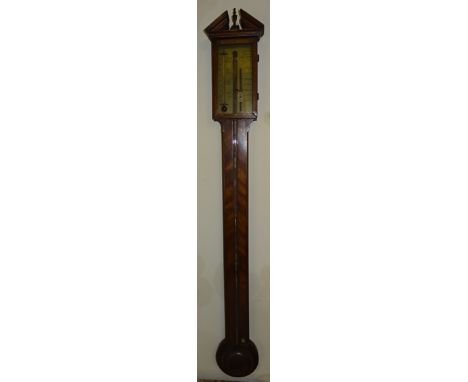 A Stick Barometer with brass register inscribed "T Gobbi & Co" in a mahogany case with broken arch pediment and circular cist