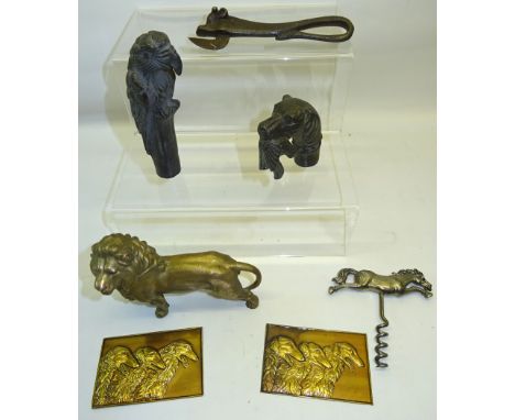 A metal Stick Handle in the form of a dogs head with a pheasant, another, galloping horse corkscrew and other items. 