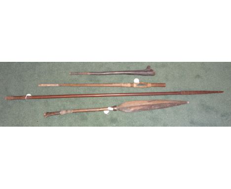 An African wood Axe Handle, a Tribal Paddle Club, and two other items.
