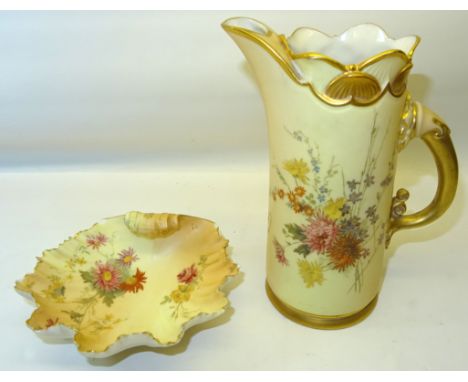 A late Victorian Royal Worcester Jug painted with floral sprays on a blush ivory ground and with gilded handle, date code for