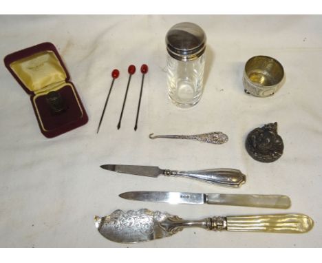 A Victorian engraved silver Butter Knife with mother of pearl handle, Victorian silver circular salt, glove button hook and o