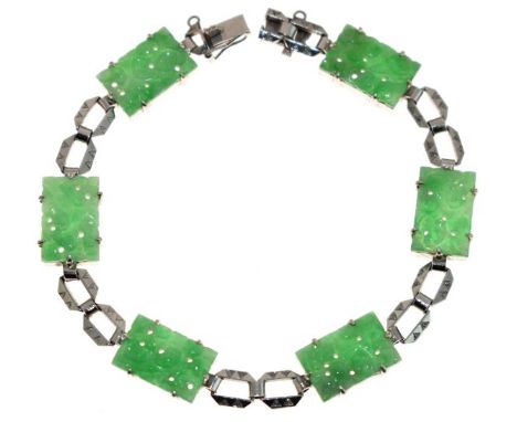 Jade bracelet, the white metal stamped '9ct', the rectangular carved panels with pairs of cut corner open links between, to a