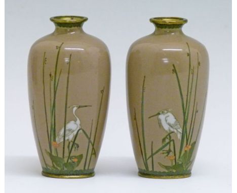Pair of small Japanese cloisonné vases, each finely decorated with a crane amongst rushes on a light brown ground, four chara