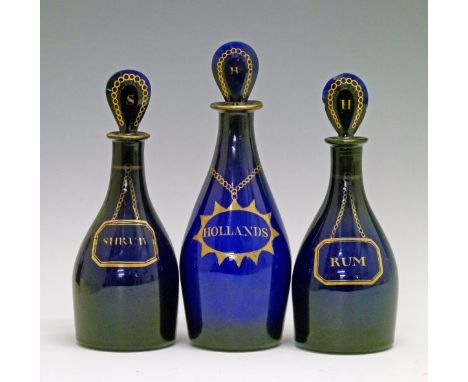 Pair of early 19th Century Bristol blue glass club shaped decanters, each having a painted gilt label Shrub and Rum, the loze