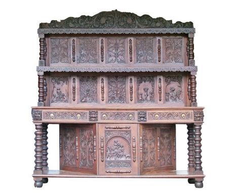 19th Century heavily carved oak dresser, the raised back fitted two stepped shelves supported by bobbin turned columns and fi