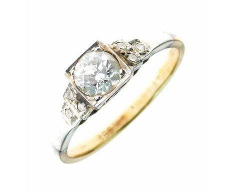 Diamond single stone ring, faintly stamped '18ct Plat', the brilliant cut of approximately 0.5 carats, with a trio of single 