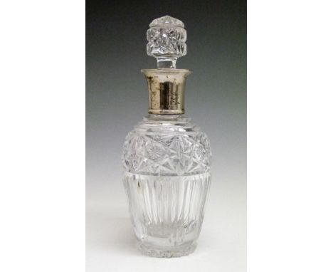 Ovoid cut glass decanter, the silver collar hallmarked for London 1936, 30.5cm high  Condition: Very minor dent to upper surf