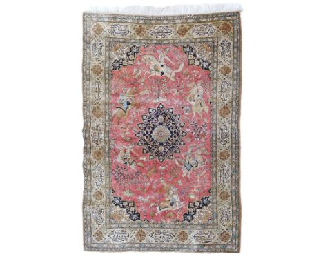 Good quality modern Persian silk rug, the central field decorated with a hunting scene on a pink ground, central medallion, w