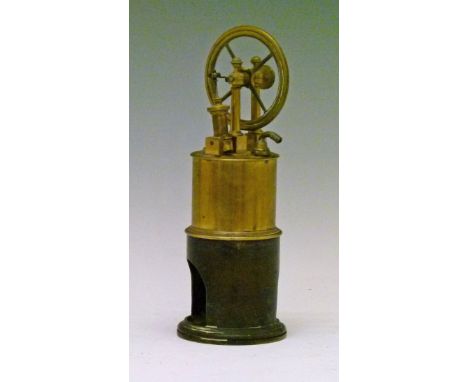 Williamson design brass vertical model steam engine having four spoked 78mm flywheel, 23cm high  Condition: Wheels move freel