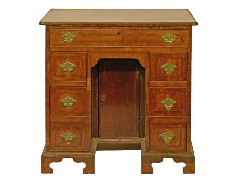 George III walnut kneehole desk fitted one long drawer and three box drawers to each pedestal, the kneehole with one drawer a