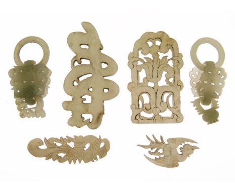 Six various 19th/early 20th Century Chinese jade pendant plaques, height of the plaques with rings 5cm  Condition: One of the