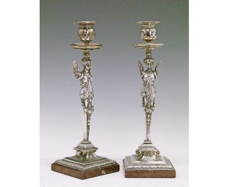 Pair of 19th Century electro plate candlesticks, each having a caryatid column, square foot and standing on a red marble base
