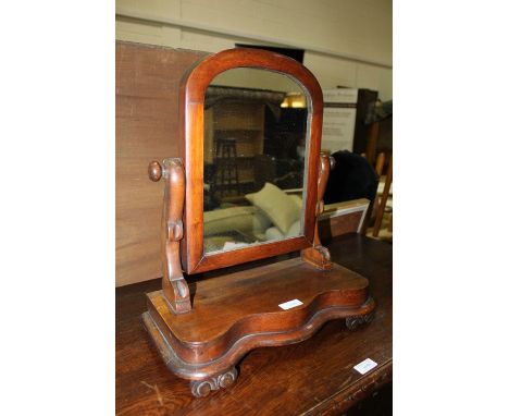 Victorian mahogany dressing table mirror, on a shaped serpentine front plinth base and scroll carved feet, 37cm wide