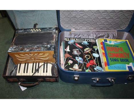 Steldeni piano accordion housed in a travelling case, quantity of sheet music housed in a suitcase (2)