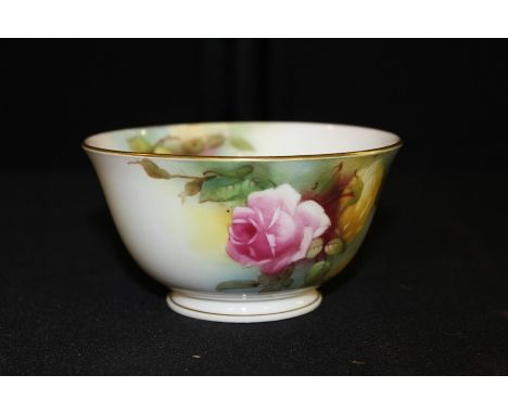 Royal Worcester porcelain sugar bowl with painted rose decoration, gilt rim and foot, purple mark to base, 12cm diameter