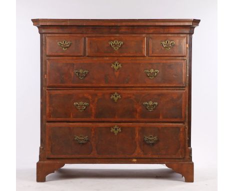 Georgian walnut chest of three short and three long drawers, the swing handles with pierced scrolled back plates, the drawers