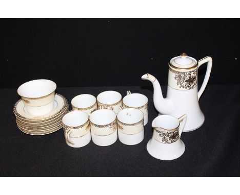 Noritake 'mosq' pattern ornate tea set, overlaid gilding on a white and cream background.