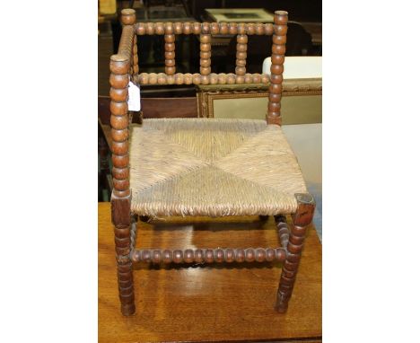 Mahogany bobbin turned child's chair of small proportions.
