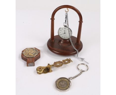 Ingersoll open face pocket watch on a white metal chain and wooden hanging stand, two pound coin key-ring, brass sovereign sc