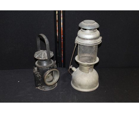 1943 Eastgate &amp; Sons military issue railway lamp, together with another, (2)