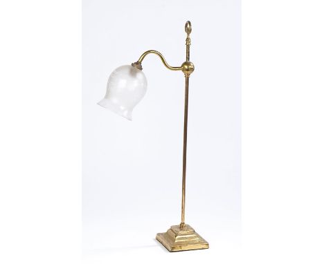 Brass desk lamp, with an arched bracket holding the frosted glass shade above a stepped base, 62cm high