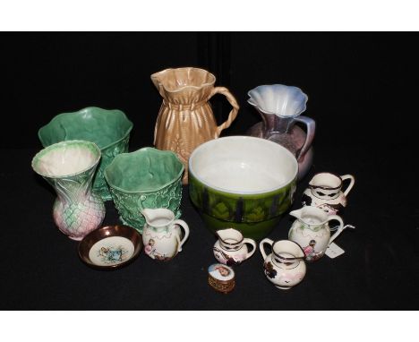 Poole pottery jardiniere, Sylvac and Falcon ware jugs, jardinieres and vase, three graduated lustre jugs etc. (qty)