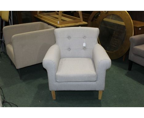 Button back easy chair, upholstered in a grey coloured material, on lightwood tapering legs