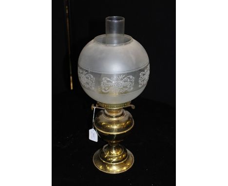 Duplex brass oil lamp, with etched scroll decorated shade, brass reservoir and foot