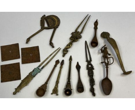 A Collection of Indian ritual shrine spoons, Indian Nut cracker, 19th century Indian deity hair pins and monkey finial topped