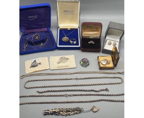 A Collection of silver jewellery to include brooches, ring with sapphire and clear stones, silver and enamel ring, various ne