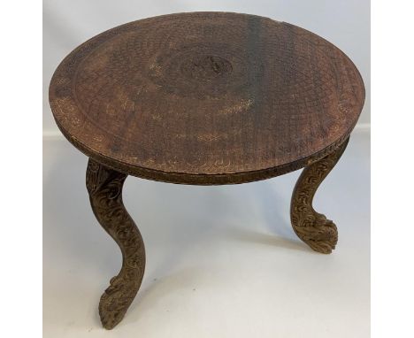 Antique hand carved Indian/ Middle East side table designed with deity carving to the centre and decorative carved legs. [54c