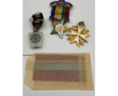 A Lot of three Masonic fob jewels. Includes Silver and enamel star shaped jewel, Yellow metal and white agate jewel. 