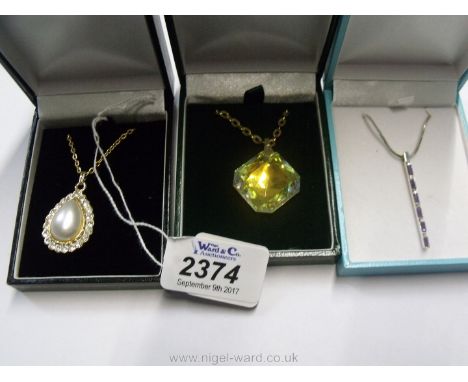 Three boxes of costume jewellery including silver chain and pendant with mauve stones, gold coloured necklace with yellow sto