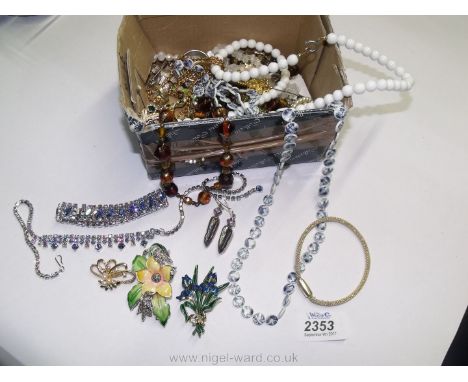 A quantity of jewellery including silver metal blue stone Necklace, bracelet and earrings set, gold metal leaf design green a