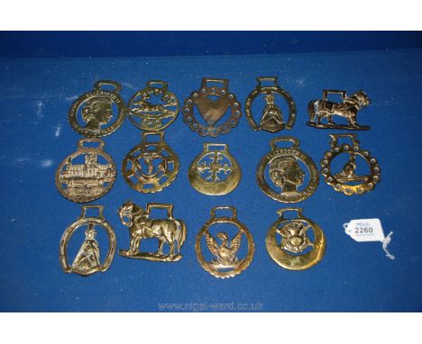 A quantity of old horse brasses, 15 in total including Elizabeth Silver Jubilee, anchor, etc. along with a triple horse harne