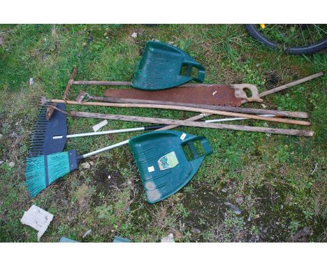 Garden tools including saw, broom and leaf grabbers.