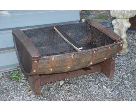 A half barrel garden planter.