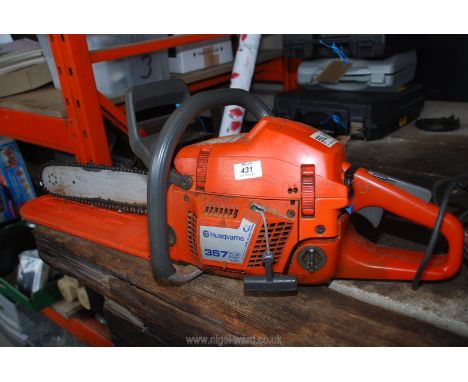 A Husqvarna 357 XP chainsaw.