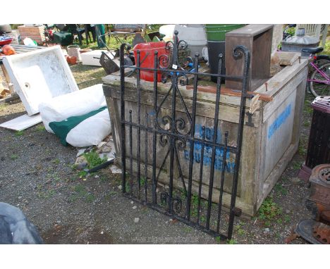 A wrought iron gate 39" x 48".