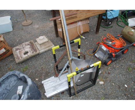 Two garden roller handles and a quantity of metal.