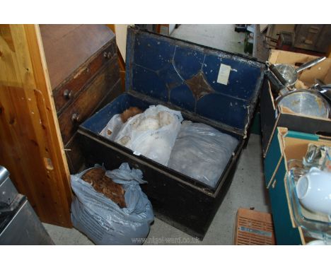 Metal trunk of raw Alpaca wool.
