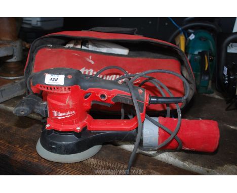 A Milwaukee cased orbital sander.