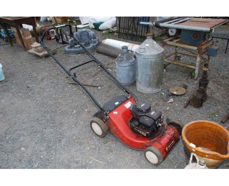 A Sovereign lawn mower with Briggs &amp; Stratton engine.