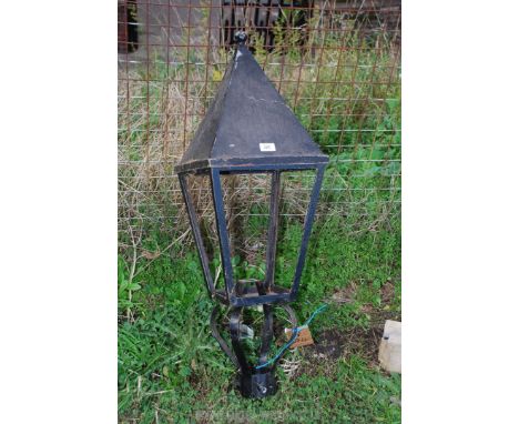 A metal lamp post lighting head.