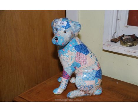 Ceramic patchwork patterned dog.