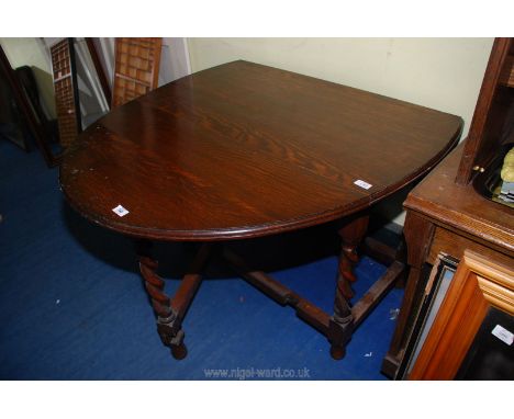 Drop leaf gate leg barley twist table. 57" extended x 42" wide.