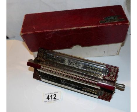 A boxed Hohner 'paddle wheel' harmonica