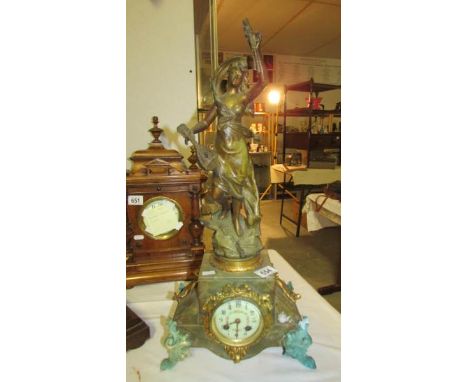 A French gilt and marble mantel clock surmounted lute player