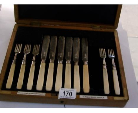 A cased set of silver fish knives and forks (missing on fork)