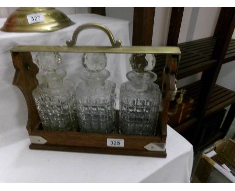 A 3 bottle tantalus with key